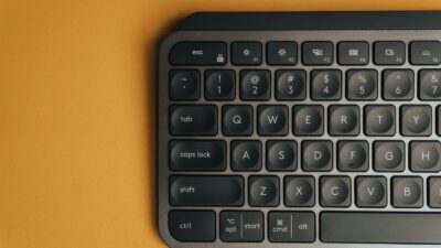 black computer keyboard on orange table